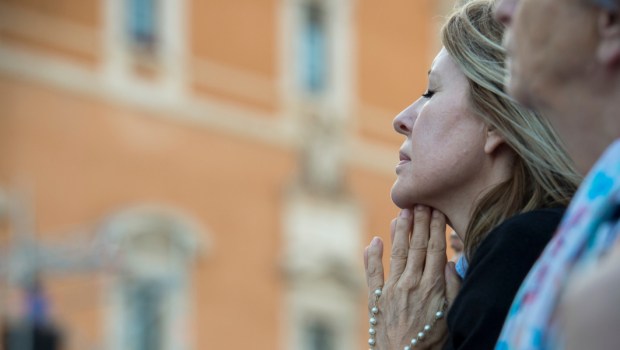 WOMAN PRAYS,