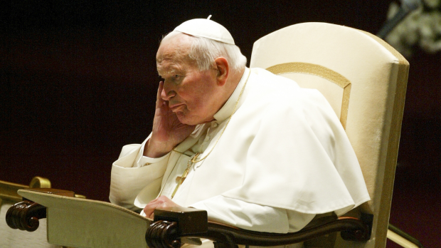 VATICAN CITY, VATICAN - 18 OCTOBER 2003: Pope John Paul II concentrates during the weekly general audience in the Nervi Hall at the Vatican.