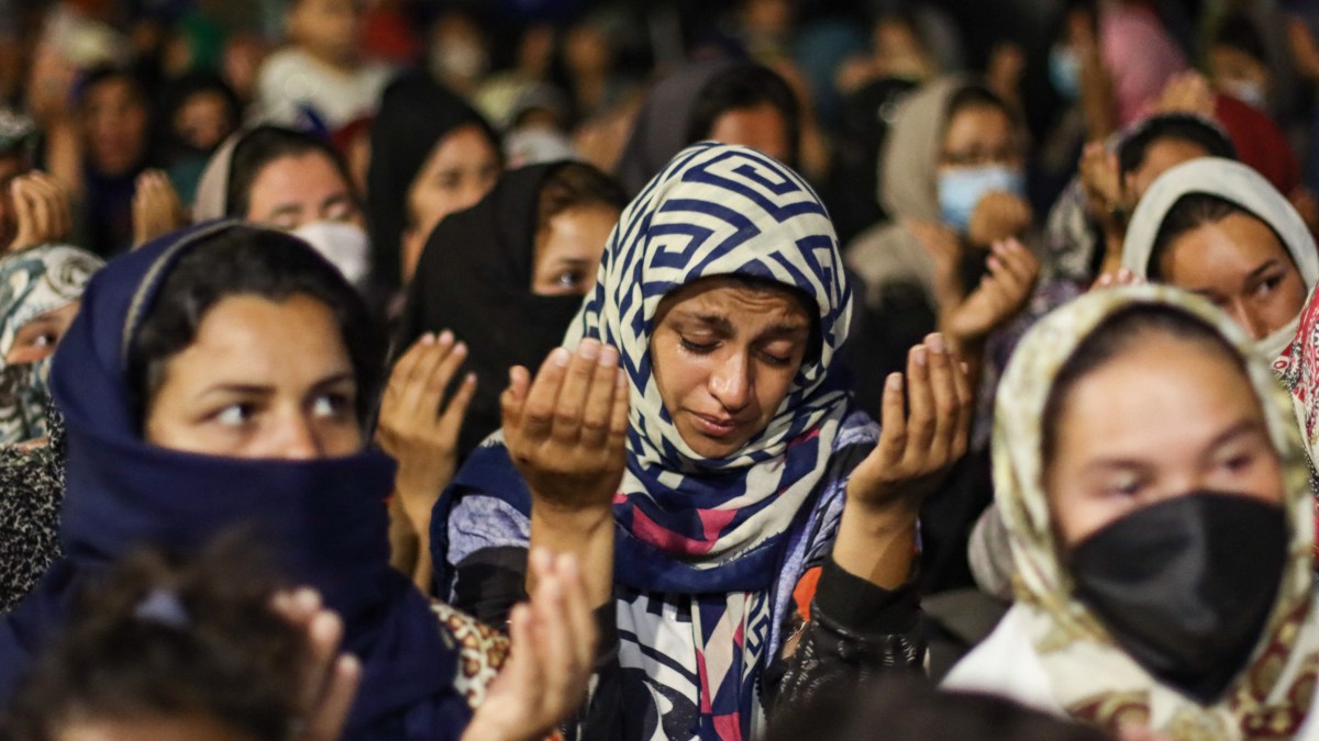 Women Refugees Pray On The Roads Of Lesbos Island