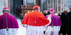 Why are cardinals assigned churches in Rome?