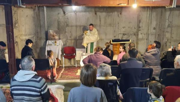Ukraine Night adoration in the shelter of St. Anthony Parish in Kyiv.
