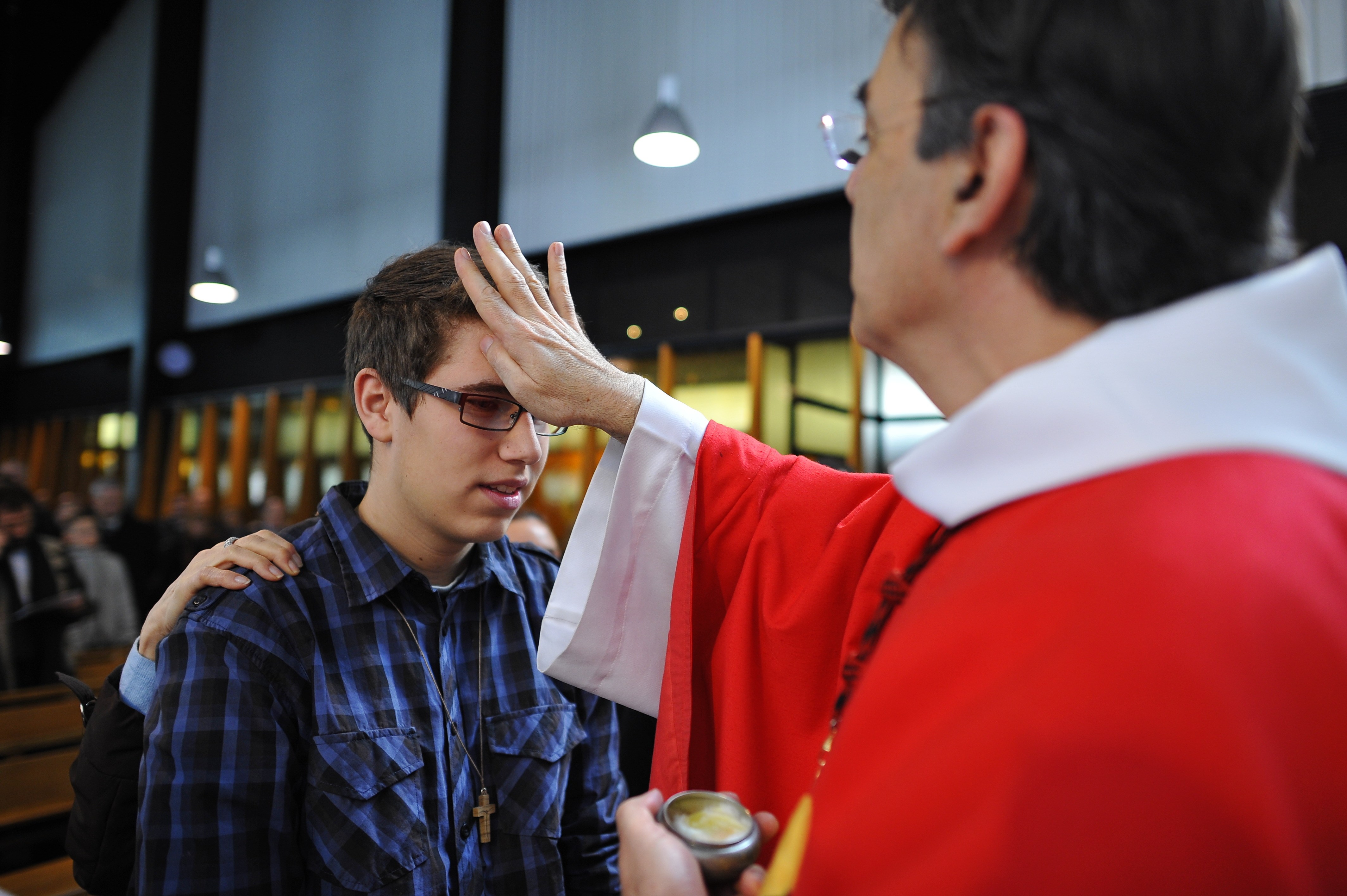 At what age is confirmation received in the Catholic Church?