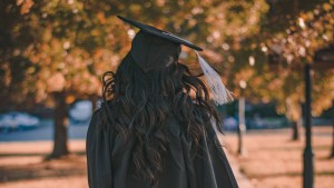 graduate, alumna, cap and gown