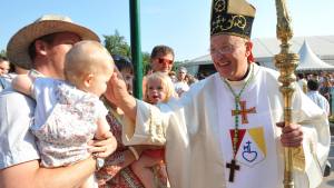 A Catholic bishop blesses a child