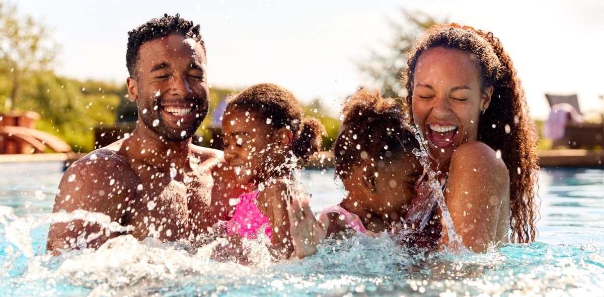 Family having fun at pool