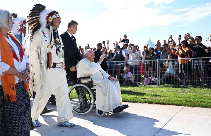 Chief-Tony-Alexis-walks-alongside-Pope-Francis-as-he-arrives-to-participate-in-the-Lac-Ste.-Anne-AFP