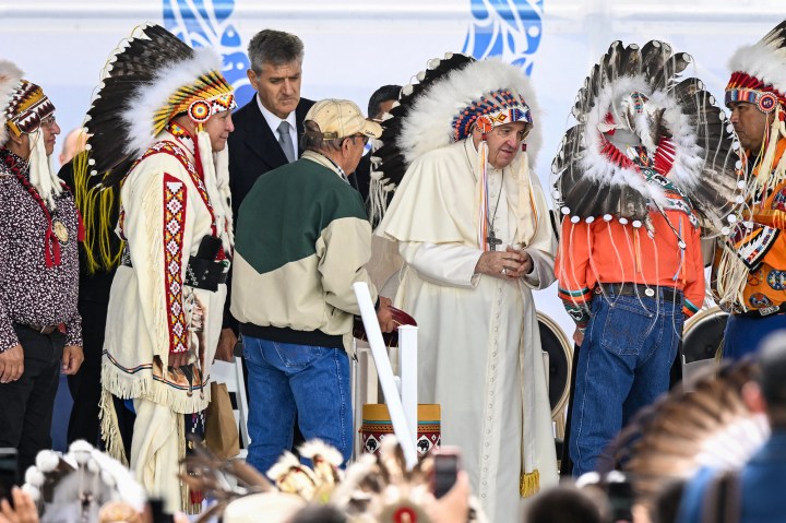 Pope-Francis-wears-a-headdress-Indigenous-leaders-at-Muskwa-Park-in-Maskwacis-Canada-AFP