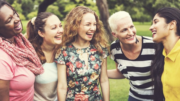 A-Group-of-Women-Socialize-Teamwork-Happiness-Concept-Shutterstock