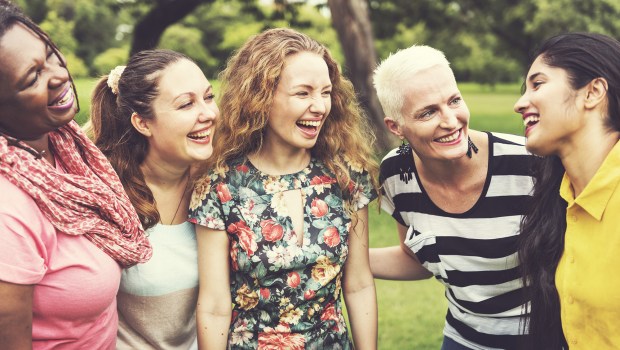 A-Group-of-Women-Socialize-Teamwork-Happiness-Concept-Shutterstock