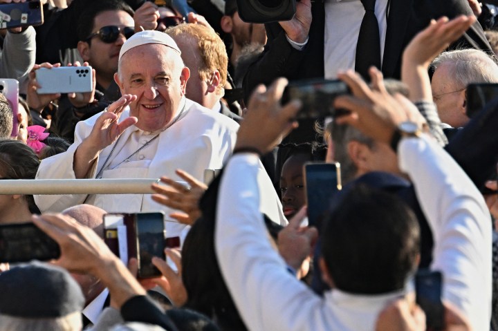 Pope-Francis-waves-as-he-arrives-for-the-weekly-general-audience-AFP