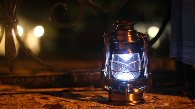 A lantern illuminates the way during a ghost tour in St. Augustine, Florida