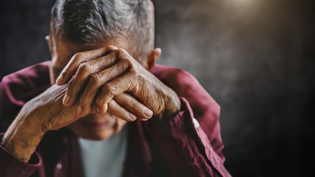 man depressed overwhelmed elderly