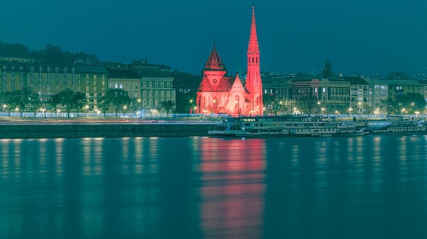Red wednesday church lit up, Hungary
