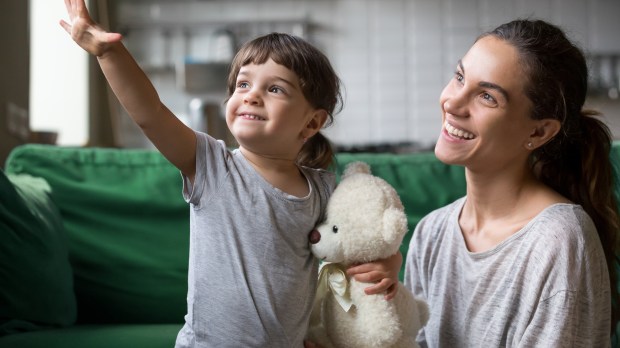 Young girl and mom looking forward to good future