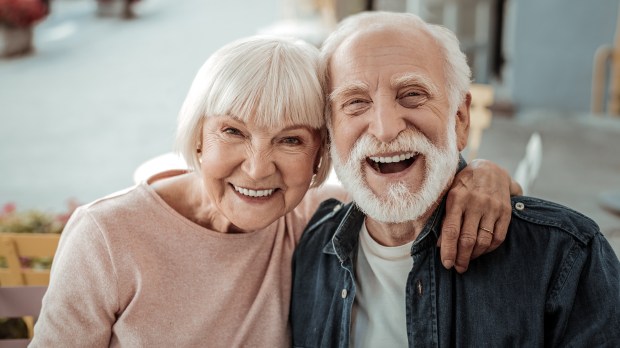 Loving and joyful elderly couple