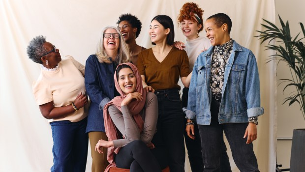 Portrait of cheerful mixed age range multi-ethnic women celebrating International Women's Day