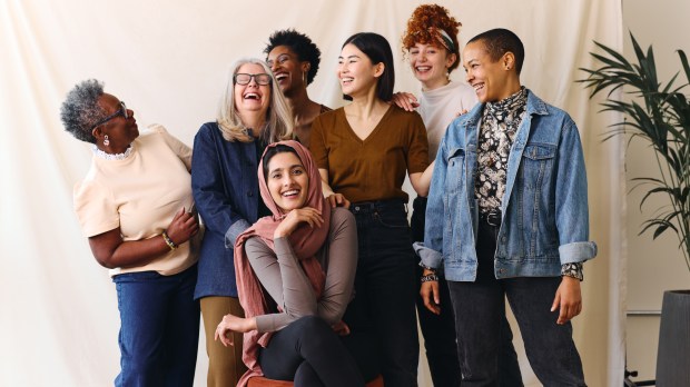 Portrait of cheerful mixed age range multi-ethnic women celebrating International Women's Day