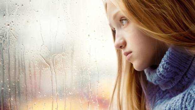 sad teen window rain
