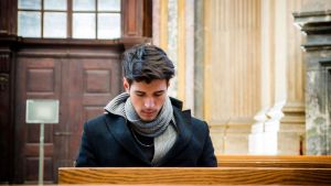 praying young man