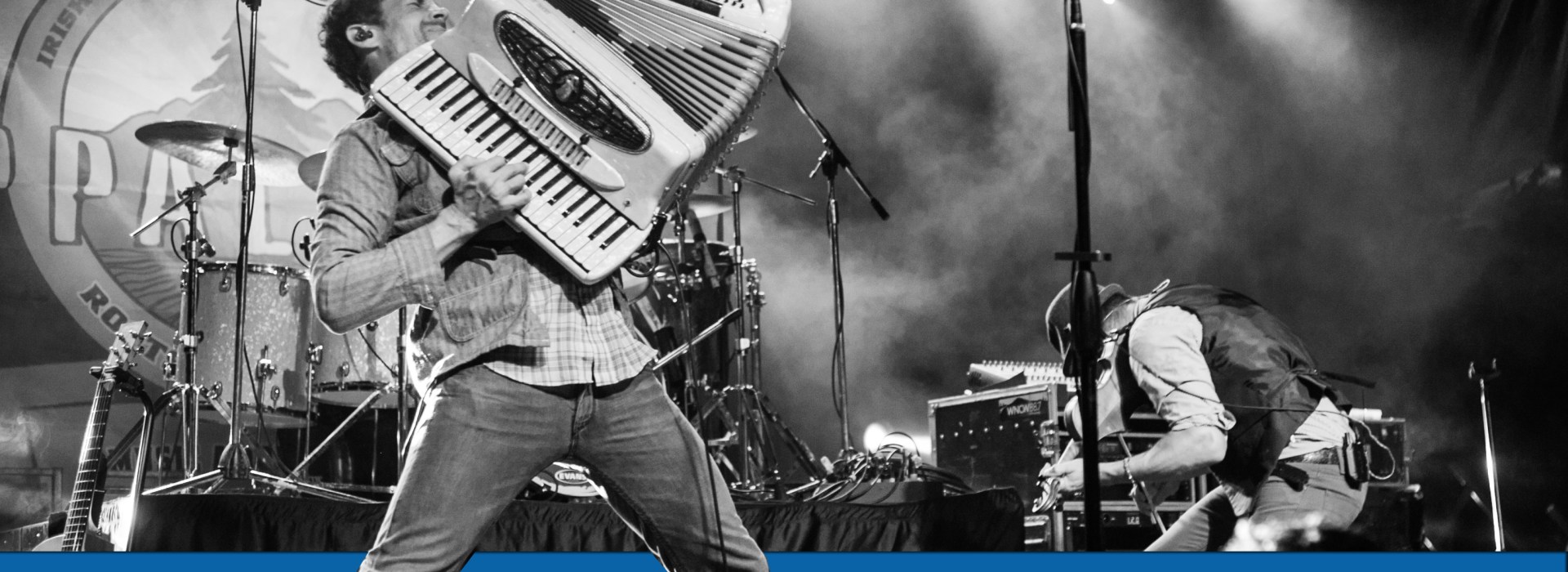 Danylo Fedorkya of Scythian on stage with accordion