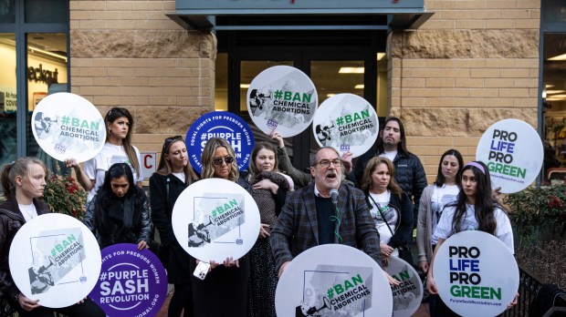 Protesters gather in front of CVS after decision to carry abortion pill