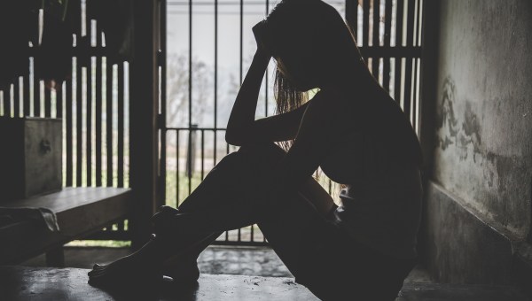 Desperate people are in a dark cell. Human trafficking, Stop abusing violence