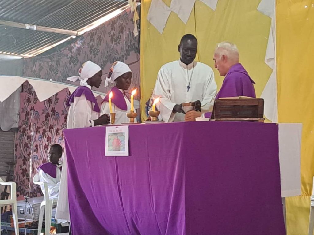 Father Michael Bassano celebrating mass in a camp in South Sudan