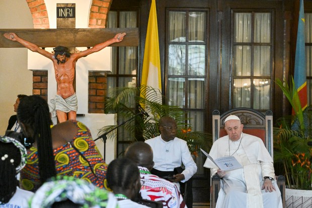 Pope-Francis-back-blesses-attendees-as-he-meets-with-victims-of-the-conflict-in-eastern-Democratic-Republic-of-Congo-AFP