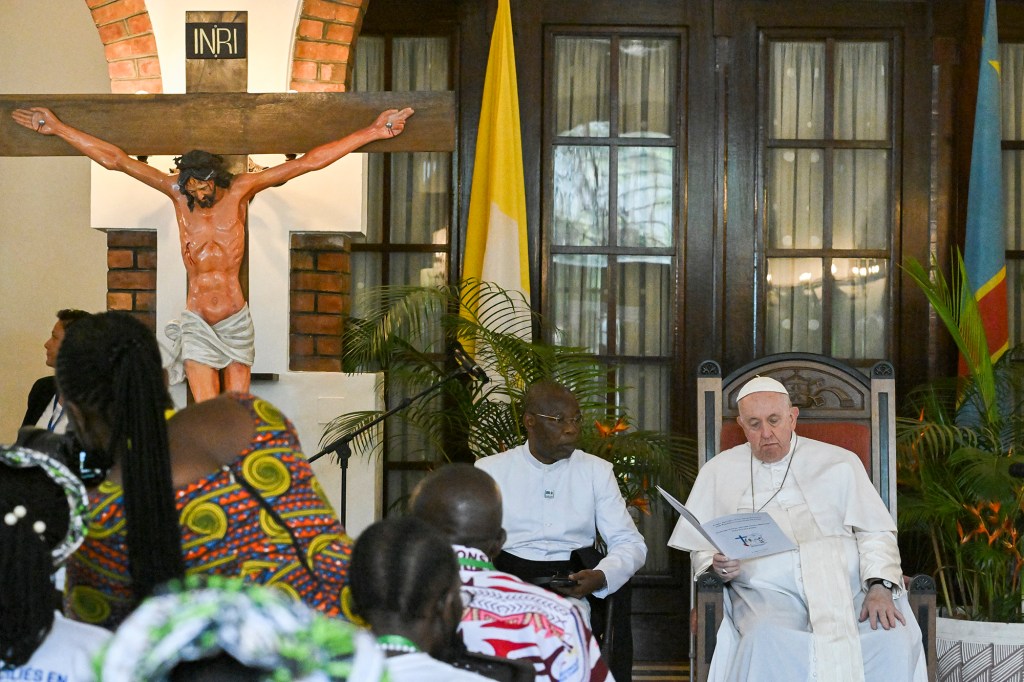 Pope-Francis-back-blesses-attendees-as-he-meets-with-victims-of-the-conflict-in-eastern-Democratic-Republic-of-Congo-AFP