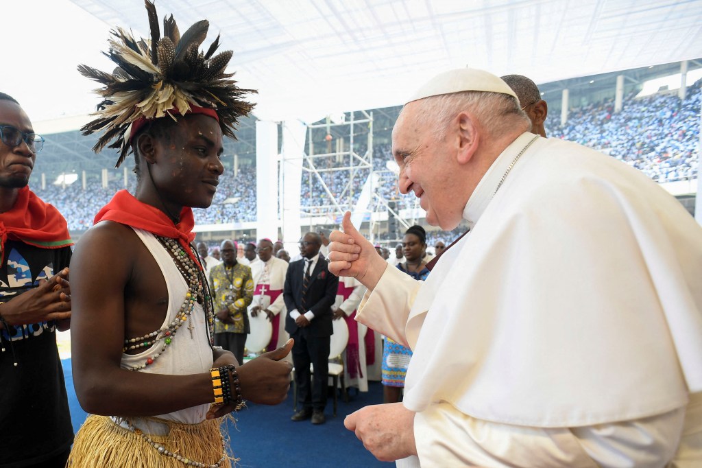 Pope-Francis-greeting-an-attendee-during-a-meeting-with-young-people-and-catechists-at-Martyrs-Stadium-in-Kinshasa-AFP