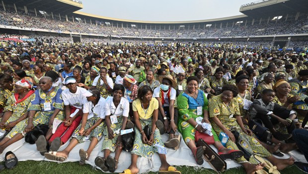 Pope-Francis-waves-as-he-arrives-by-popemobile-for-a-meeting-with-young-people-and-catechists-at-Martyrs-Stadium-in-Kinshasa-AFP