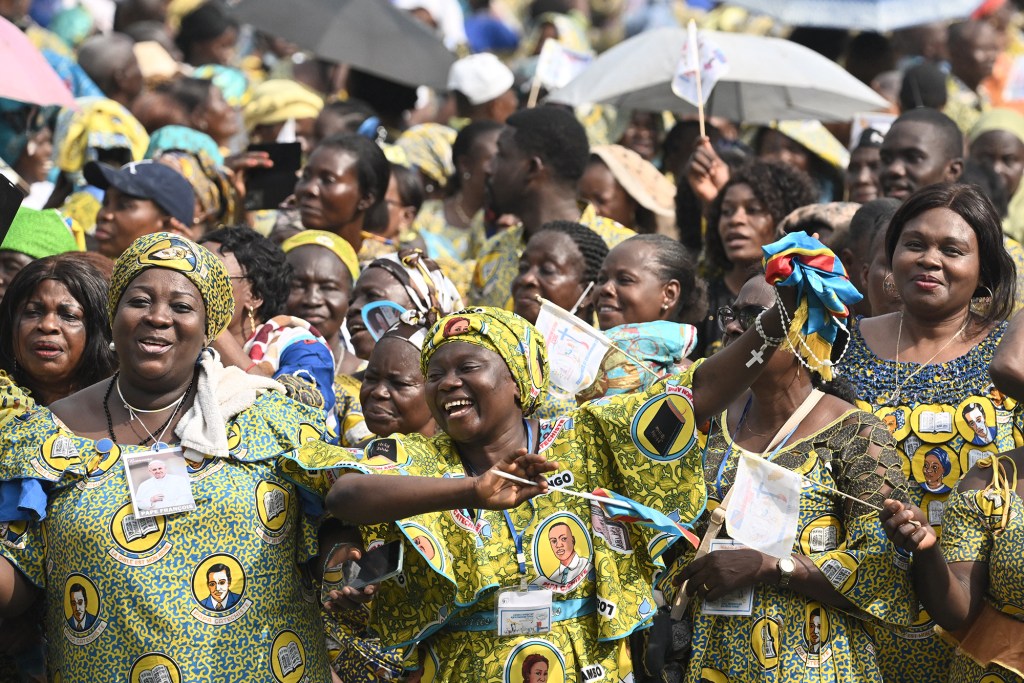 Pope-Francis-waves-as-he-arrives-by-popemobile-for-a-meeting-with-young-people-and-catechists-at-Martyrs-Stadium-in-Kinshasa-AFP