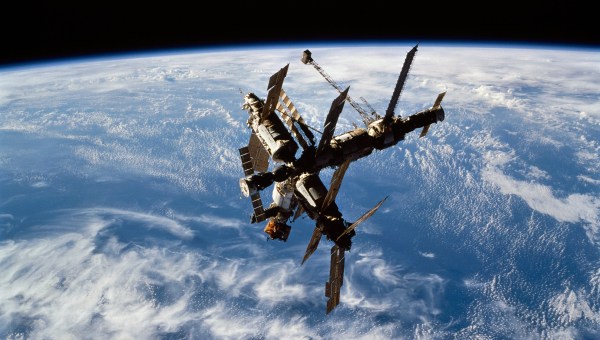 View-of-the-complete-Mir-Space-Station-after-docking-against-a-dark-background