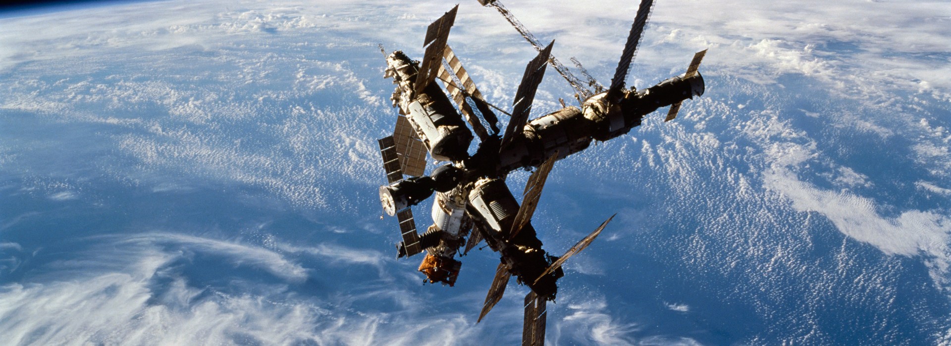 View-of-the-complete-Mir-Space-Station-after-docking-against-a-dark-background