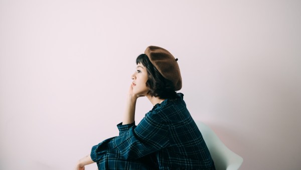 woman thinks seriously, meditates, thinks about the problem