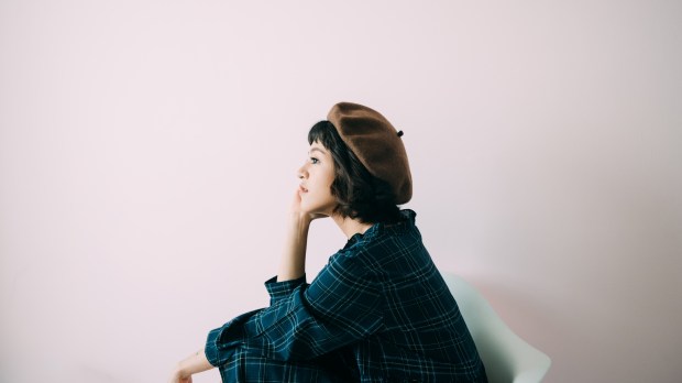 woman thinks seriously, meditates, thinks about the problem