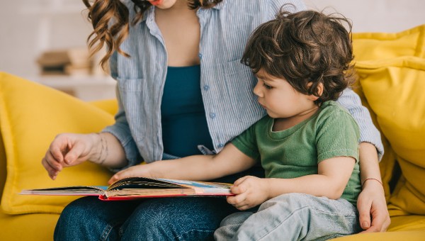 mother and son reading book