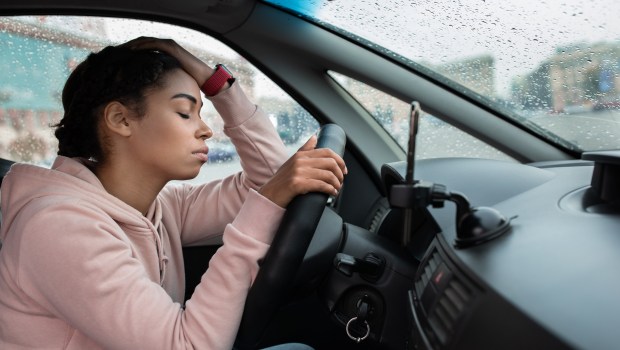 woman distressed car