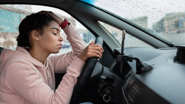 woman distressed car