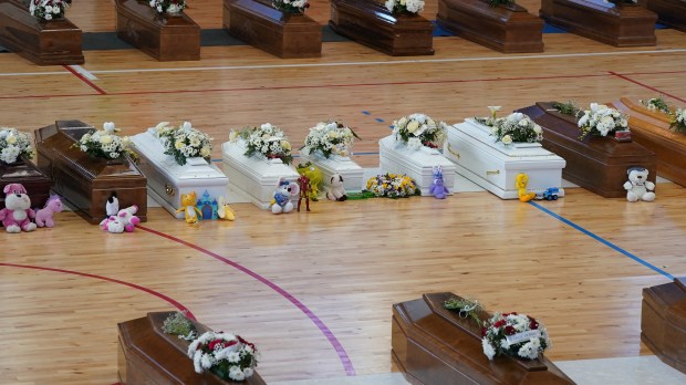 Coffins-containing-people-who-died-in-a-migrant-shipwreck-lie-in-state-at-Palasport-in-Crotone-Italy-AFP