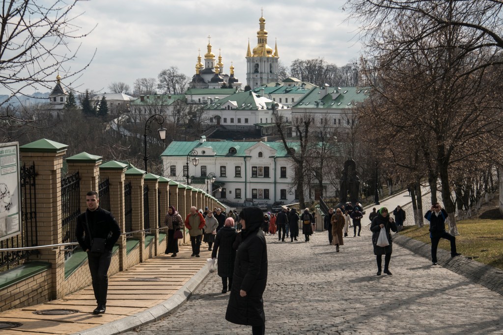 Pilgrims walk through Kyiv Monastery of the Caves complex