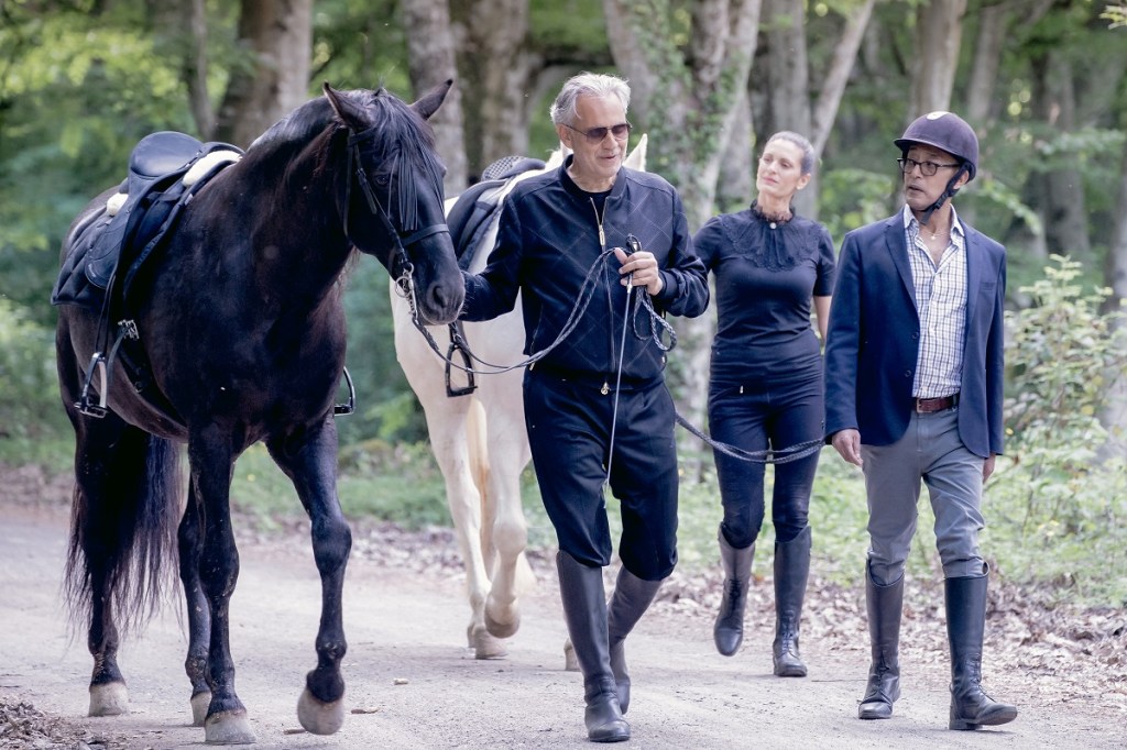NOT FOR REUSE: Andrea Bocelli walks with horse