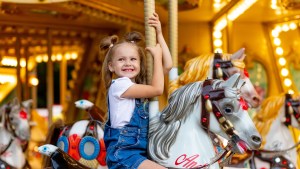 girl smiling carousel