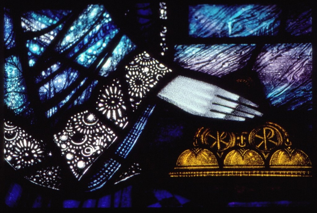 Bell-ringing altar boy depicted in stained glass