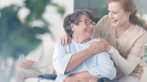 younger woman smiling at older woman