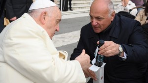 Rome's chief police commissioner gives Pope Francis a bottle of oil to be used in the chrism mass. The oil comes from a garden dedicated to Judge Giovanni Falcone and others who died in an attack by the Sicilian mafia.