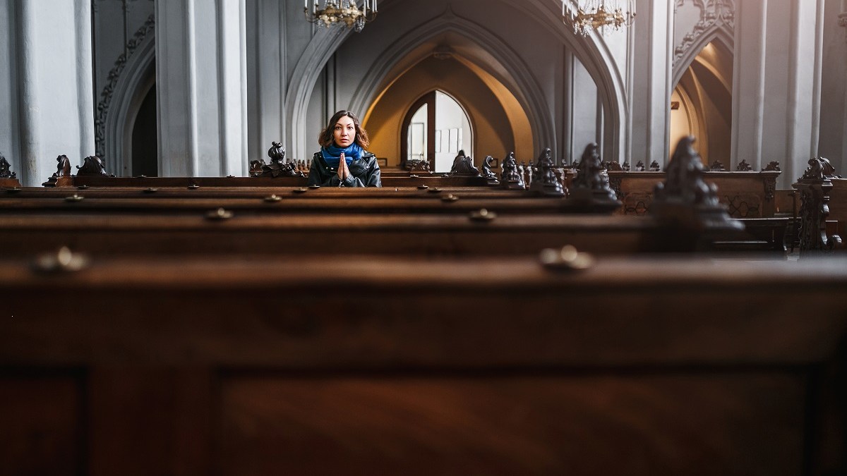 Lone Hispanic woman in church