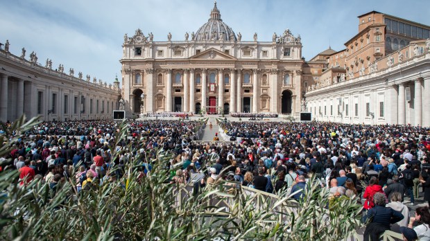 Pope Francis blesses the faithful at the end of Palm Sunday Mass in St. Peter's Square