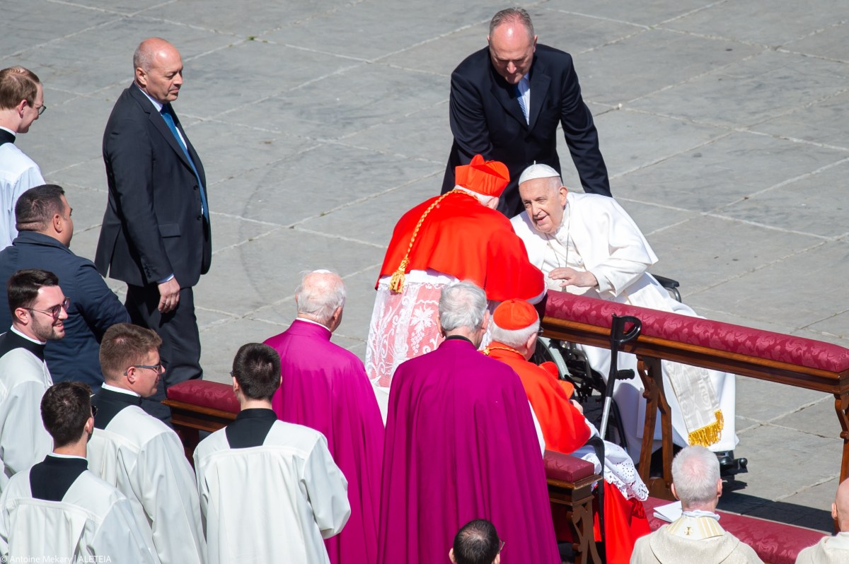 Pope Francis prays at the start of the Easter Sunday mass on April 9, 2023