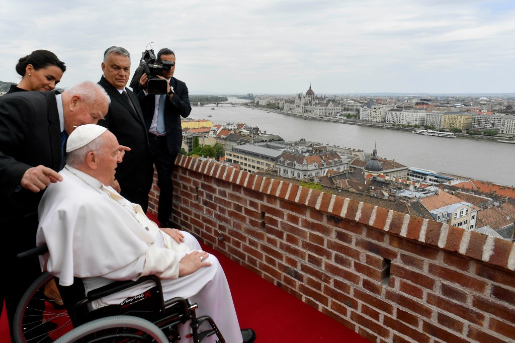 Pope Francis overlooking the city with Hungary's President Katalin Novak and Hungary's Prime Minister Viktor Orban after a meeting with the authorities
